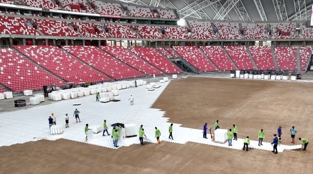 EevrBase Flooring is installed by a team of workers in a stadium